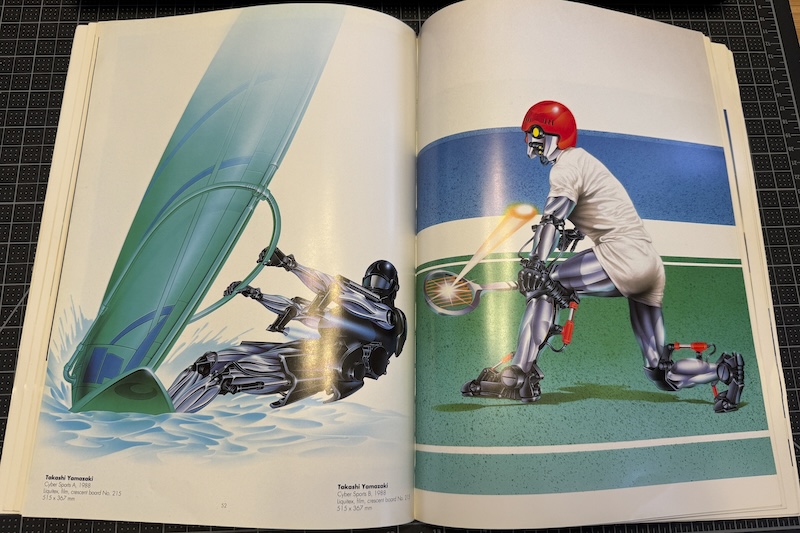 the book opened to takashi yamazaki's two cyber sports illustrations - one is a robot windsurfing, another is a robot playing tennis