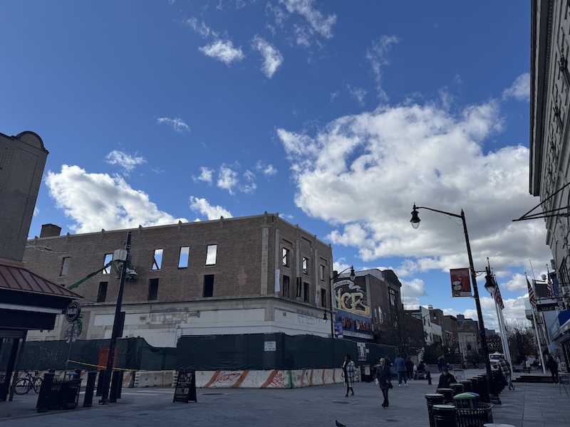 photo of the building barcade was in on newark ave in the process of being broken down - there is no roof or windows, as is noticeable by the blue sky showing through where the windows were