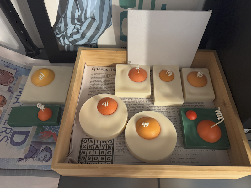 photo of a bunch of egg candle prototypes curing on my desk