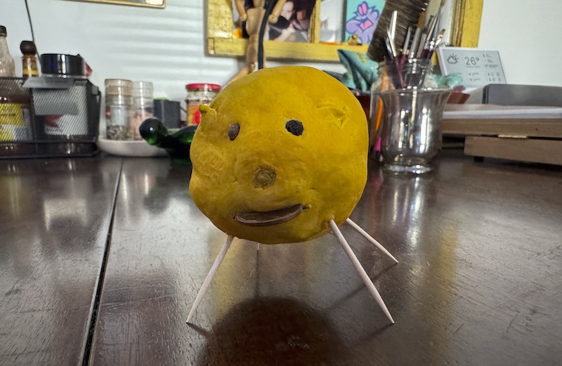 photo of my air dry lemon pig but it's now painted yellow like a lemon