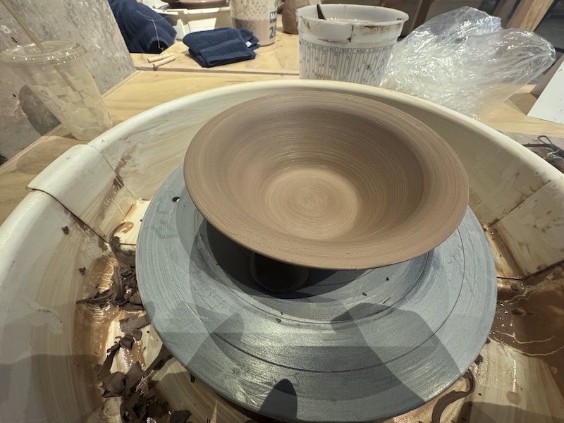 photo of a bowl i am trimming on the pottery wheel