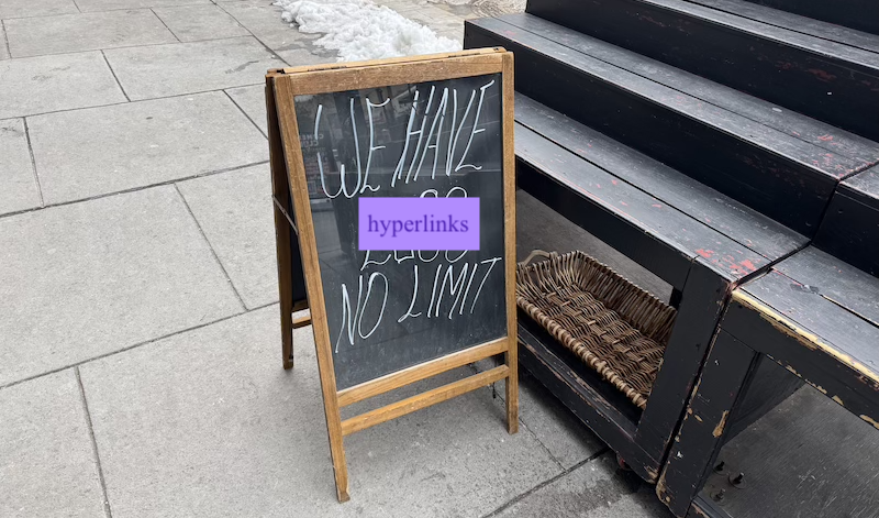 photo of a chalk sandwich board that said "we have eggs no limit" but i replaced "eggs" with "hyperlinks" in a purple text on light purple background box